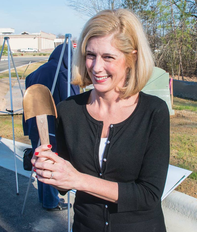 Nicole Heaps, director of senior services for Maumelle, holds a small golden shovel that she used to turn the dirt during the groundbreaking Friday for the $4.6 million Maumelle Senior Wellness Center. She said the shovel will be placed in a shadow box and displayed in the new center, which is scheduled to be completed in December.