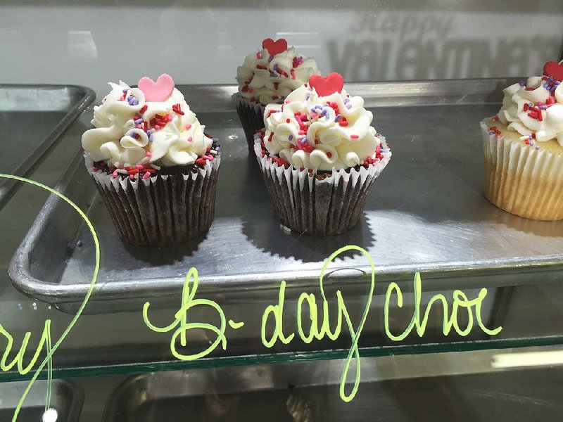 “Birthday cake” cupcakes on display at The Cupcake Factory in Little Rock. Birthday and wedding cake are two of their most popular flavors. 