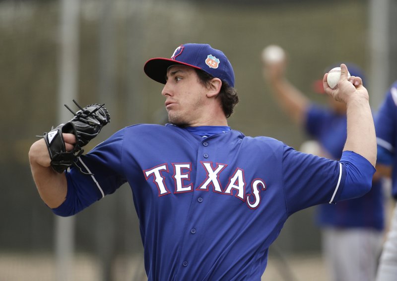 This is a 2013 photo of Derek Holland of the Texas Rangers