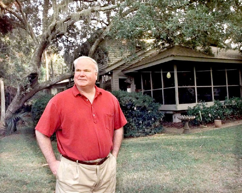 Novelist Pat Conroy stands at the back of his house on Fripp Island, S.C., in this Nov. 3, 2000 file photo. 
