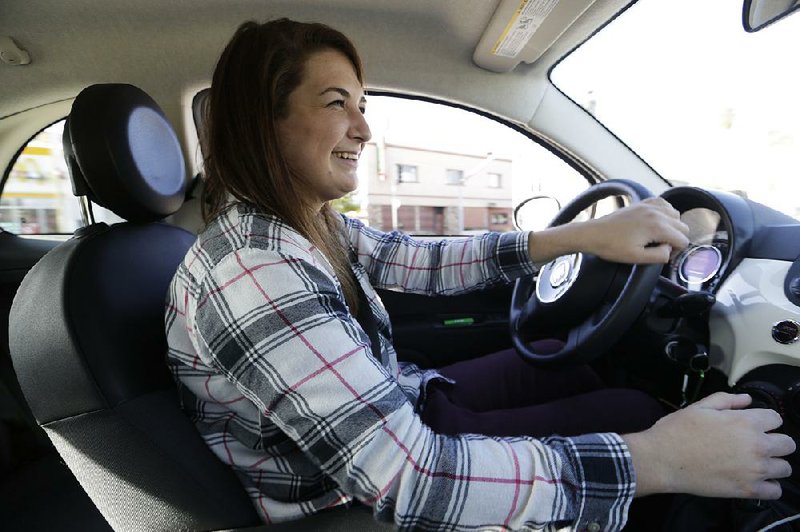 Lucy Mueller drives her 2015 Fiat 500 in Los Angeles in late December. Mueller lived in Los Angeles for eight years without a car before she fi nally bought one in July.