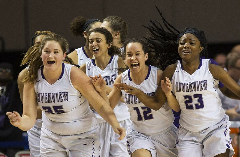 Riverview players celebrate after Friday’s victory over Central Arkansas Christian in the Class 4A girls final. Riverview finished the season 38-0.