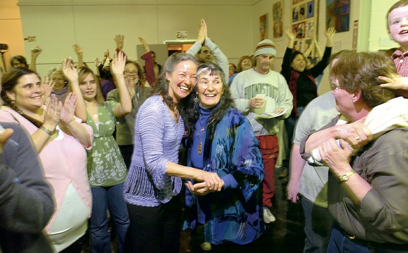 Vick Kelley, left, and Diana Rivers, founders of the Fayetteville Goddess Festival, celebrate during the opening ritual for a previous event. This year, Rivers will be honored for her contributions.