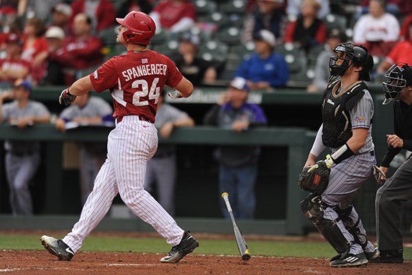 Arkansas right fielder Chad Spanberger watches as a towering three-run home run sails over the right field fence against Western Illinois Saturday, March 12, 2016, during the third inning of the Razorbacks' 9-3 win at Baum Stadium.