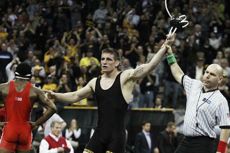 Iowa's Sammy Brooks, right, celebrates after defeating Nebraska's T.J. Dudley, left, in the 184 pound weight class finals during the Big Ten wrestling championships at Carver-Hawkeye Arena in Iowa City, Iowa, on Sunday, March 6, 2016. 