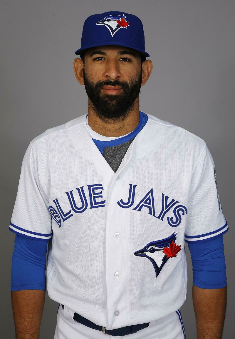 Jose Bautista of the Toronto Blue Jays wears the new red jersey