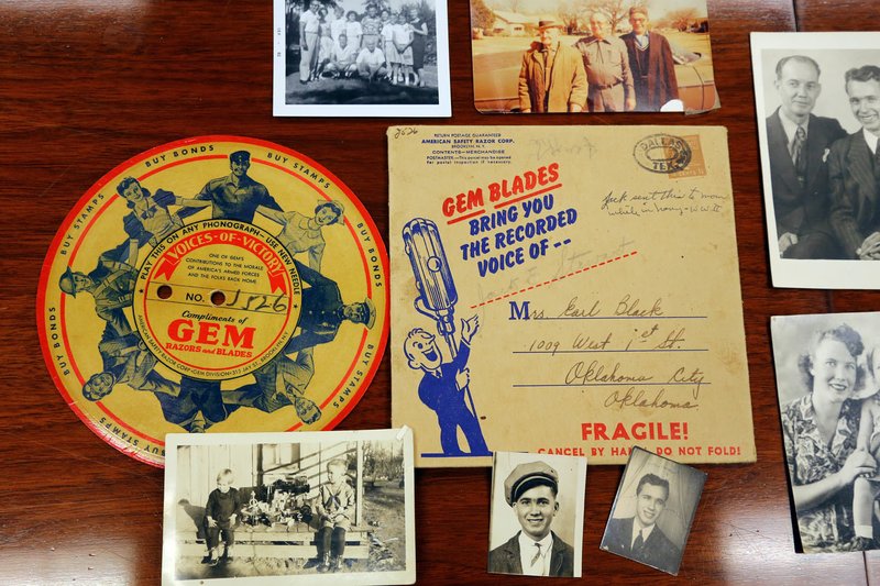 Some of the unclaimed items the Arkansas State Auditor&#8217;s office is trying to reunite with their owners are pictured. The office opens abandoned safety deposit boxes, catalogs the contents and tries to find the owners. These are photos and other items from World War II.