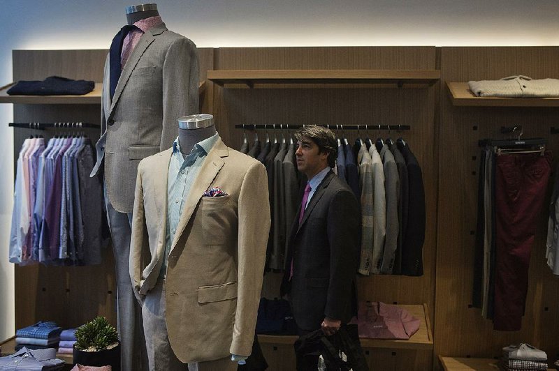 A shopper browses in a Bonobos store in the Brookfield Place shopping area in New York in this file photo. Bonobos is one of several online businesses that have recently opened stores.