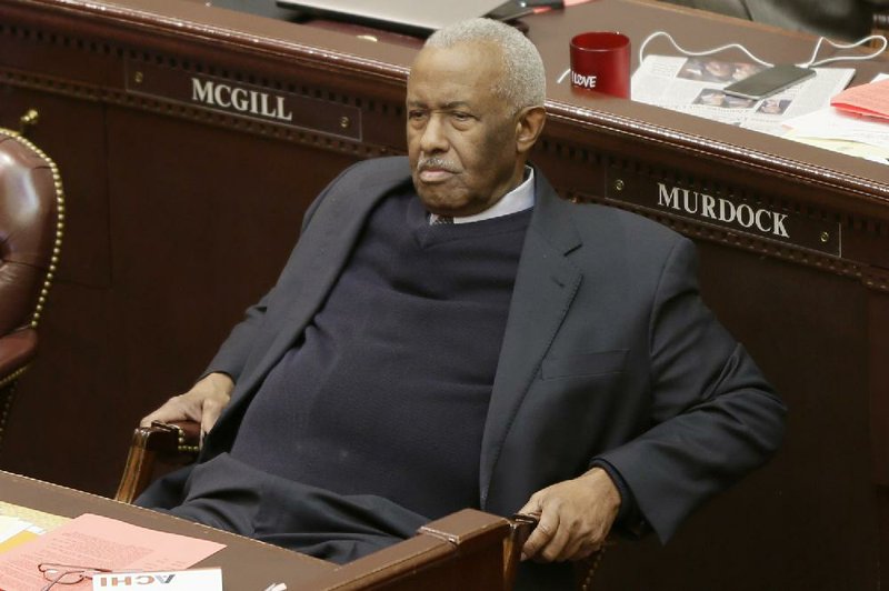 Rep. John Walker, D-Little Rock, listens to a presentation of a bill dealing with creation of new school districts the House chamber at the Arkansas state Capitol in Little Rock, Ark., Tuesday, Feb. 17, 2015. The bill failed to pass. (AP Photo/Danny Johnston)
