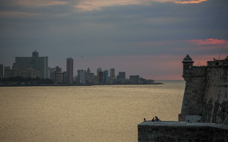 Tourists visiting the Spanish colonial Morro fortress in Havana enjoy Wednesday’s sunset.