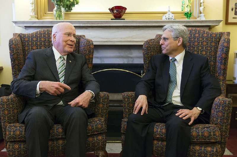 Sen. Patrick Leahy, D-Vt., (left) the top Democrat on the Senate Judiciary Committee, which considers judicial nominations, visits Thursday with Judge Merrick Garland on Capitol Hill.