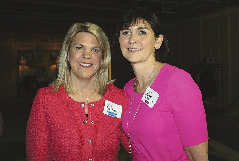 Judith McKenna (right), Koman Ozark Race for the Cure 2016 honorary chairwoman, visits with Sue Redfield, 2015 honorary chairwoman, at the kickoff celebration March 2.