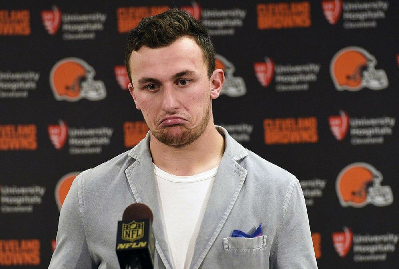 FILE - In this Nov. 15, 2015, file photo, Cleveland Browns quarterback Johnny Manziel attends a post-game news conference after a 30-9 loss to the Pittsburgh Steelers, in Pittsburgh. The Browns have released troublesome quarterback Johnny Manziel.  The team cut ties on Friday, March 11, 2016, with the 2012 Heisman Trophy winner after two disappointing, drama-filled seasons. Manziel faces an uncertain future in the NFL and potential criminal charges in Texas following a domestic violence incident.  (AP Photo/Don Wright, File)