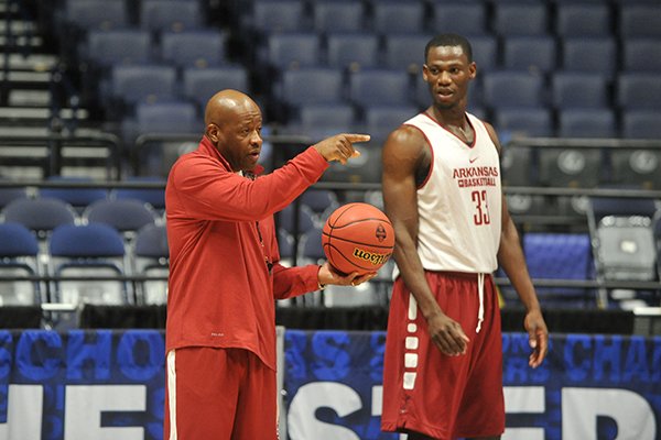 Arkansas coach Mike Anderson, left, and junior Moses Kingsley go through practice Wednesday, March 9, 2016, at Bridgestone Arena in Nashville, Tenn. 