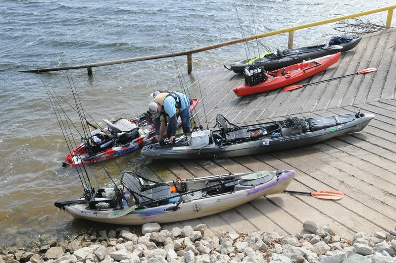 Kayak anglers begin landing March 6 at the Swepco Lake boat ramp after a bass tournament on the reservoir near Gentry. Fishing kayaks can be outfitted with an array of equipment, such as electronics, rod holders and storage compartments.