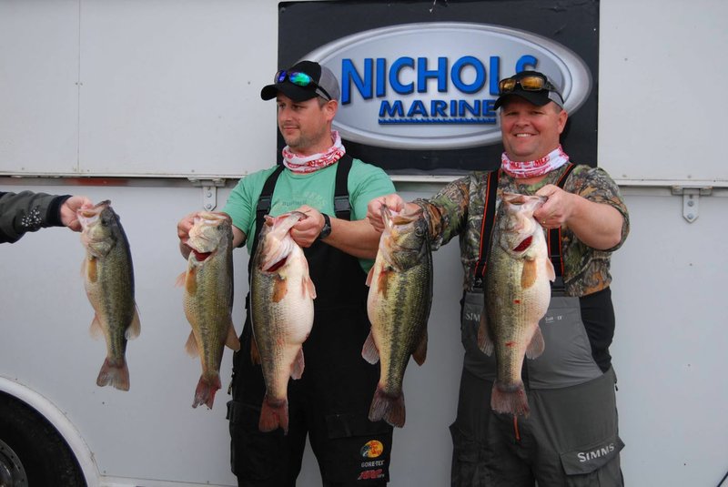 Justin Cooper (left) and Heath Konkler, both of Bentonville, show their Grand Lake catch of five largemouth bass, which weighed 32.41 pounds. Their largest bass weighed 8.47 pounds and the smallest weighed 5 pounds.