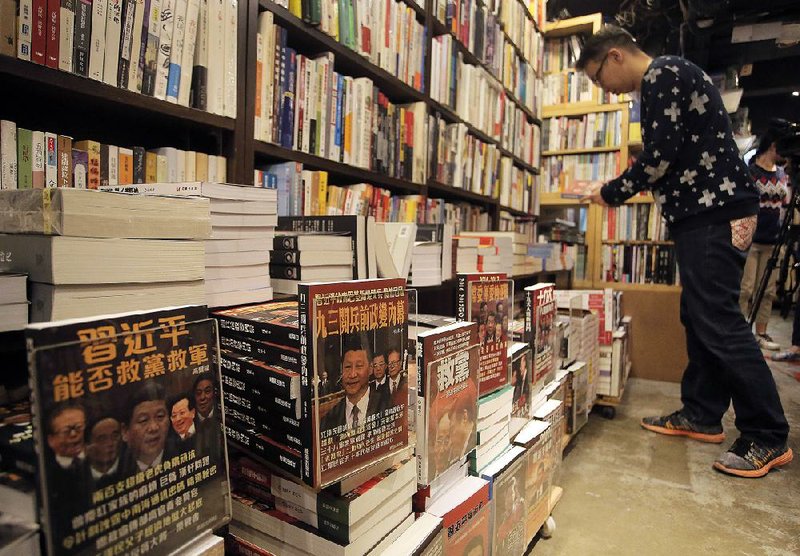 Book covers featuring Chinese President Xi Jinping and other senior officials sit on display in January in a shop in Hong Kong, where political tensions with China are eroding long-enjoyed freedoms. 