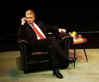 bill clinton dress red shoes Satirical depiction of Bill Clinton in an armchair on Craiyon