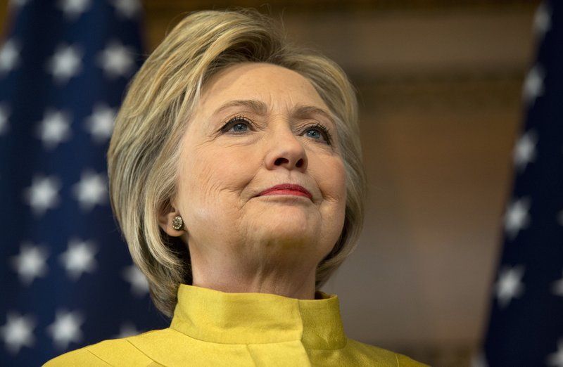 Democratic presidential candidate Hillary Clinton stands on stage as she is introduced by former U.S. Ambassador to Russia Michael McFaul to speak about counterterrorism, Wednesday, March 23, 2016, at the Bechtel Conference Center at Stanford University in Stanford, Calif. (AP Photo/Carolyn Kaster)