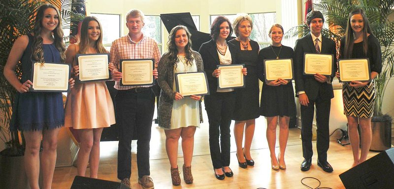 First lady Susan Hutchinson, sixth from left, congratulates local high school seniors on receiving $500 scholarships from Altrusa International of Hot Springs Village. The seniors are, from left, Madison Hair, Caddo Lowery and Jonathan Semmier, all of Jessieville High School; and Sarah Bearden, Alexa Donley, Lexi Hood, Barry Kohr and Vanessa Nobles, all of Fountain Lake High School.