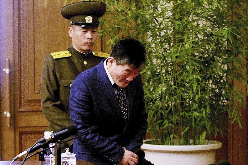 Kim Tong Chol, a U.S. citizen detained in North Korea, is taken to a news conference Friday in Pyongyang.