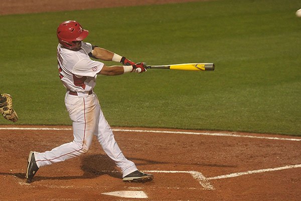 Arkansas' Michael Bernal connects on a two-run home run during the fifth inning of a game against Auburn on Saturday, March 26, 2016, at Baum Stadium in Fayetteville. 