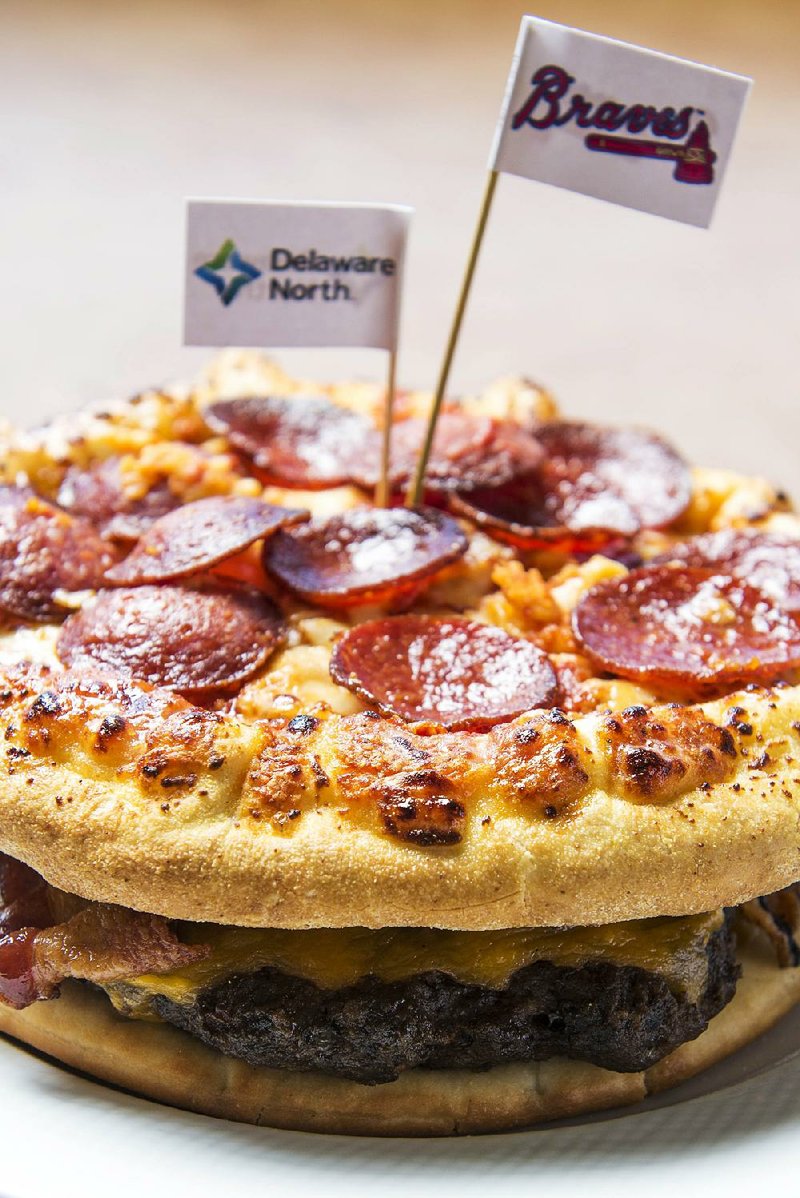 Concession stands at Turner Field in Atlanta are set to serve the “Burgerizza.” It’s a 20-ounce beef patty, smothered with five slices of cheddar cheese and bacon, between a pair of 8-inch pepperoni pizzas. All for only $26.