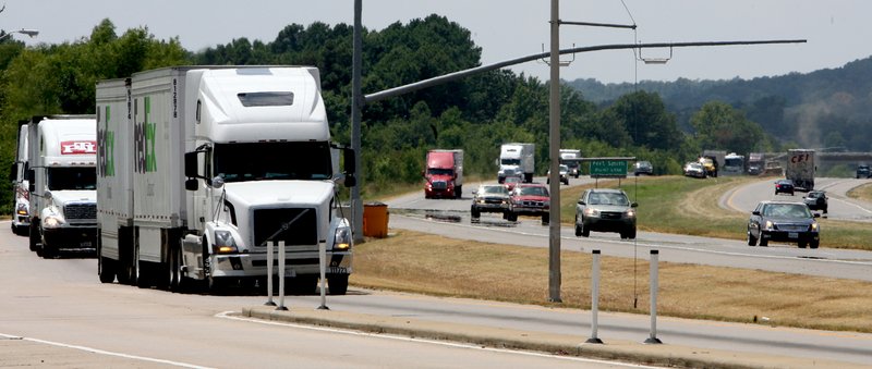 Eastbound trucks pull into a weigh station on Interstate 40 near Alma in this file photo.