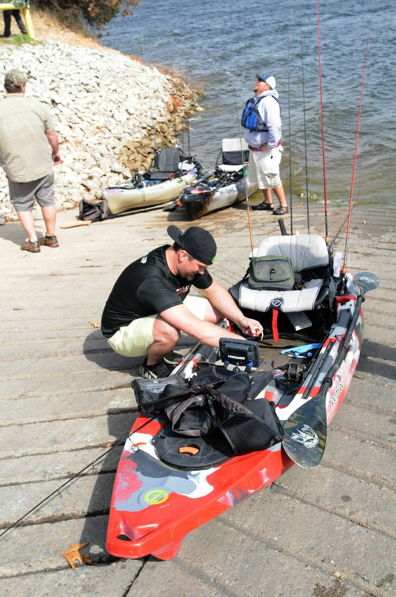 By Flip Putthoff Sam Philip of Centerton tends to his kayak March 6, 2016 after fishing. Philip normally uses six fishing rods and pulls each one out of holders behind him &quot;like pulling arrows out of a quiver,&quot; he said.