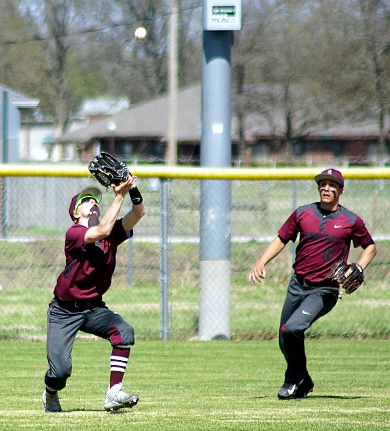 Photo by Randy Moll Drake Barnes catches a fly ball hit out between center and right fields in a game at Gentry on Friday between the Gentry Pioneers and the Junction City Dragons.