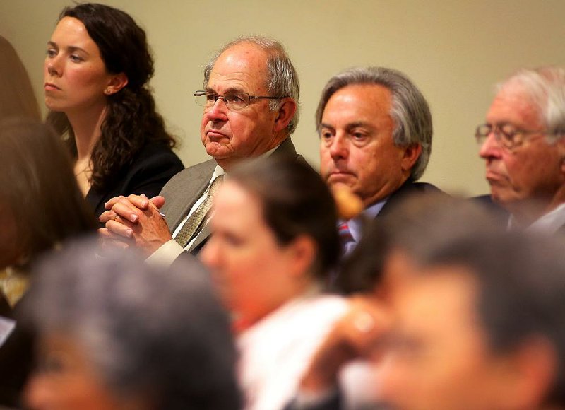 Arkansas Supreme Court Chief Justice Howard Brill (second from left) listens Wednesday during a hearing on judicial campaigns held by the Senate Judiciary Committee in Little Rock.