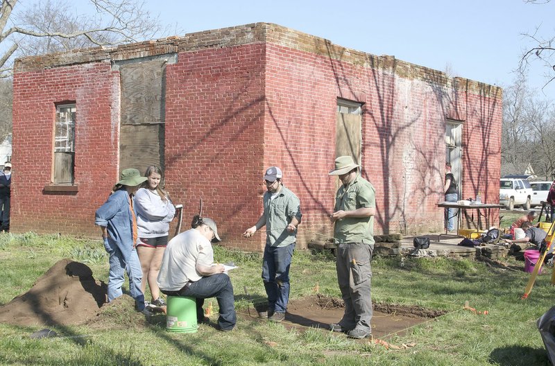 Archaeologists and volunteers work in March 2015 to excavate the site of the Methodist manse in Canehill. The manse was used as a church for 20 to 30 years before the congregation outgrew it, the first Methodist church in Canehill.