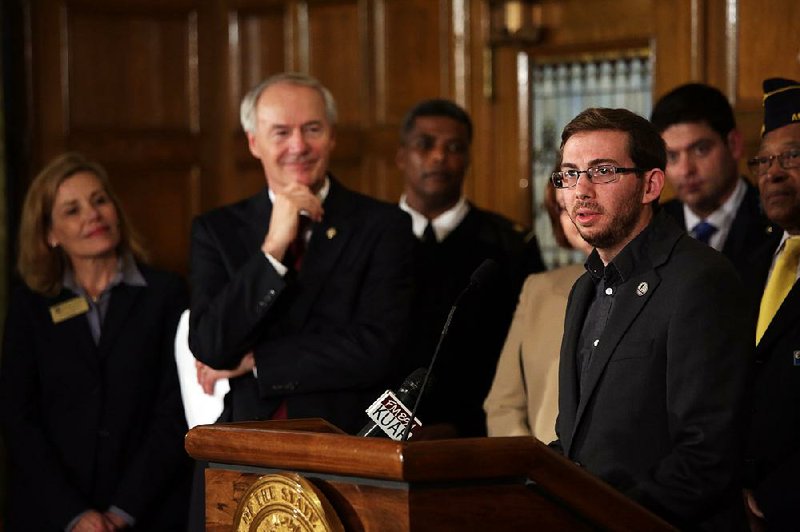 Joseph Weishaar, a member of the winning design team for a World War I monument to be built in Washington, D.C., speaks at an event at the state Capitol on Thursday. 