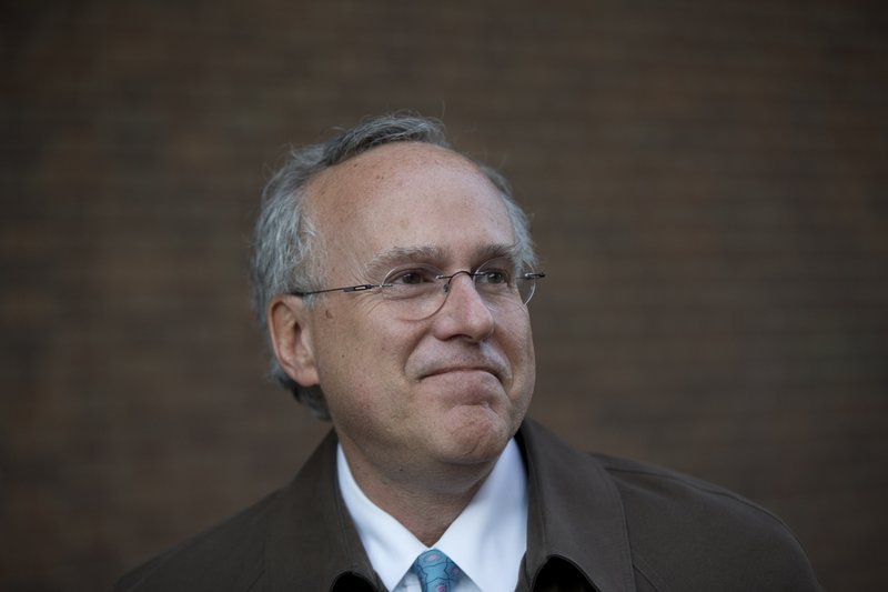 In this Nov. 19, 2014, file photo, Dr. Robert Stern of Boston University poses for a photograph outside the U.S. Courthouse after a hearing on the proposed NFL concussion settlement in Philadelphia. A preliminary study by Boston University researchers shows a link between the number of hits a player takes in youth, high school and college football and the development of cognitive difficulties as an adult. 