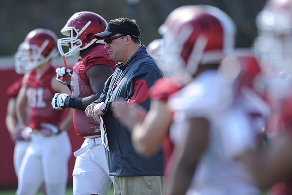 Arkansas coach Bret Bielema directs his players Thursday, March 31, 2016, during practice at the university's practice field on campus in Fayetteville.
