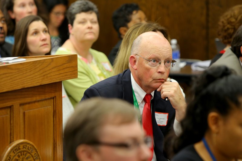 Little Rock School District Superintendent Baker Kurrus listens to proceedings during a special evening meeting of the Arkansas State Board of Education Thursday night.