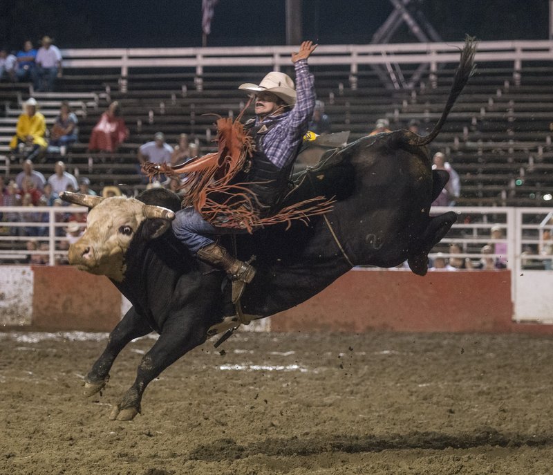 Corey Atwell of Moravian Falls, N.C., rides a bull named Maverick during the 2015 Rodeo of the Ozarks at Parsons Stadium in Springdale. The Rodeo of the Ozarks officials have announced new dates for the annual event, hoping to draw more top cowboys and more fans.