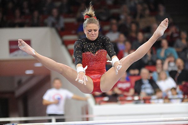 Arkansas' Amanda Wellick competes Friday, March 11, 2016, in the bars rotation during the 11th-ranked Razorbacks' meet with Utah State in Barnhill Arena in Fayetteville. 