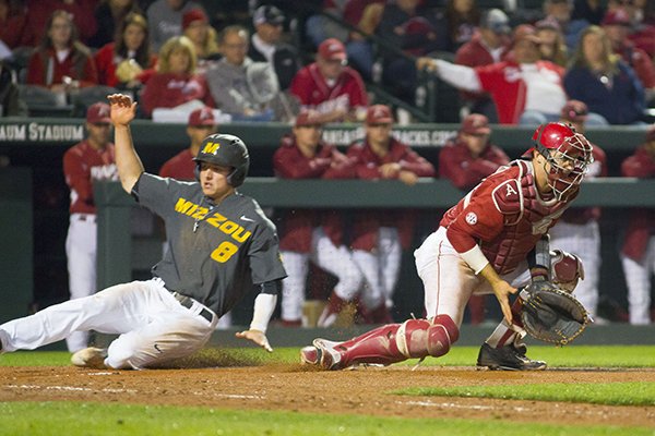 Missouri's Ryan Howard (8) scores a run during a game against Arkansas on Saturday, April 2, 2016, at Baum Stadium in Fayetteville. 