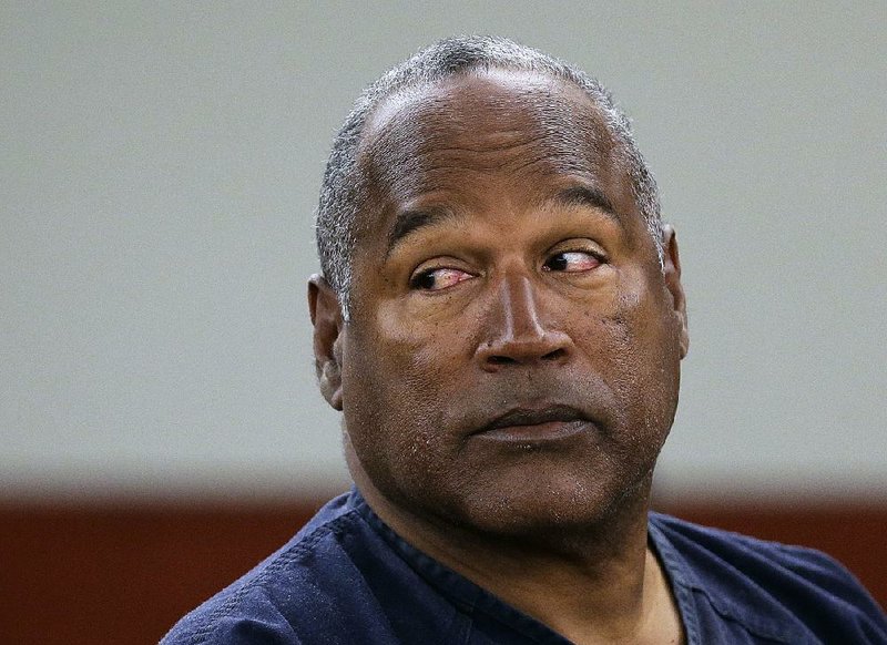  In this May 13, 2013, file photo, O.J. Simpson appears at an evidentiary hearing in Clark County District Court, in Las Vegas.