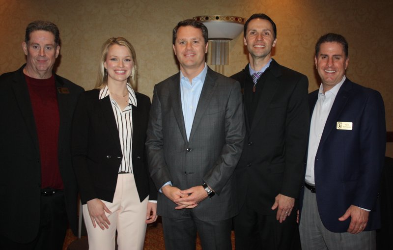 Jack Eaton, Single Parent Scholarship Fund of Benton County executive director (from left); Sarah Beers; Doug McMillon, Wal-Mart Stores Inc. president and chief executive officer; Brian Wood; and Hank Schepers gather at a VIP reception before the scholarship fund’s annual Corporate Luncheon on Wednesday.