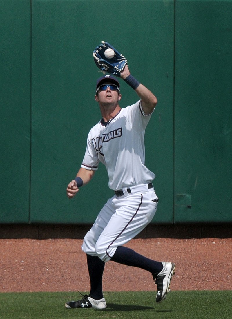 Bubba Starling, Northwest Arkansas center fielder, fields a fly ball during the 4th inning on Sunday June 14, 2015 during the game against Arkansas at Arvest Ballpark in Springdale. 