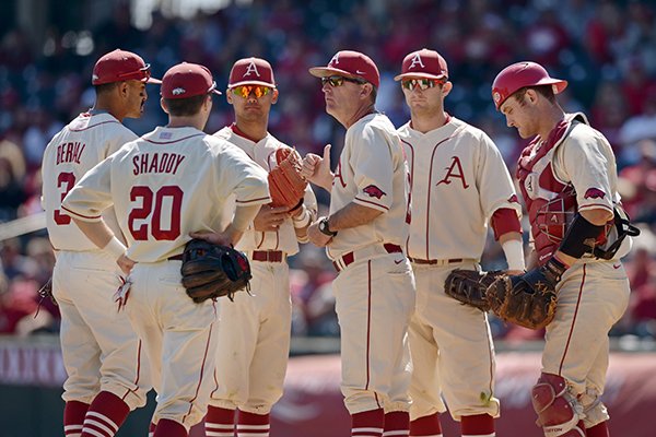 Arkansas coach Dave Van Horn talks with players during the eighth inning of a game against Missouri on Sunday, April 3, 2016, at Baum Stadium in Fayetteville. 