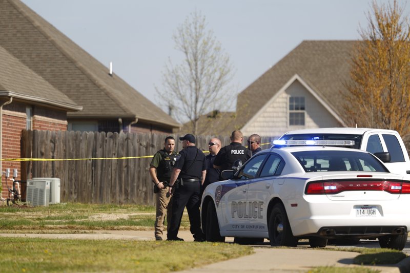 Police investigate after a woman was shot at her home in Centerton on Tuesday, April 5, 2016.