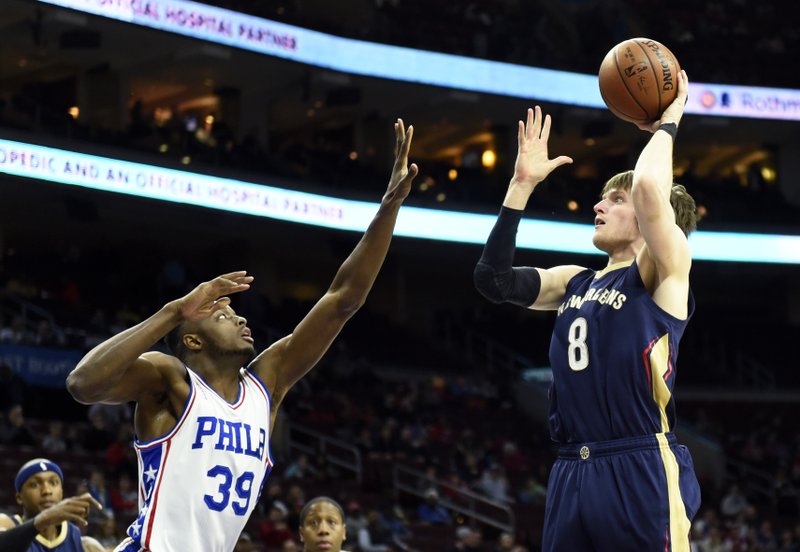 New Orleans Pelicans' Luke Babbitt (8) takes a shot over Philadelphia 76ers' Jerami Grant during the first half of an NBA basketball game, Tuesday, April 5, 2016, in Philadelphia. 