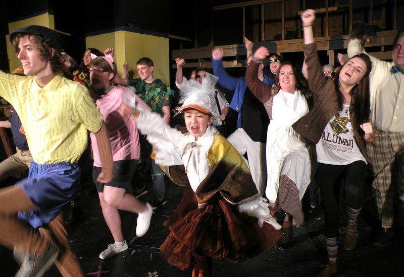 Pinocchio, played by Ethan Patterson, front, leads some of the fairy-tale characters in this rehearsal scene from Shrek the Musical, which will open Thursday at The Royal Theatre in Benton. Other visible characters include Isabelle Nguyen as the Ugly Duckling; Darren Wrinkler as one of the Three Little Pigs; Gabe Gordy as Peter Pan; Rachel Brown as Mama Bear (in a white apron); Danny Troillett as Papa Bear (wearing a bow tie); and Morgan Potter as Elf (wearing a brown jacket).