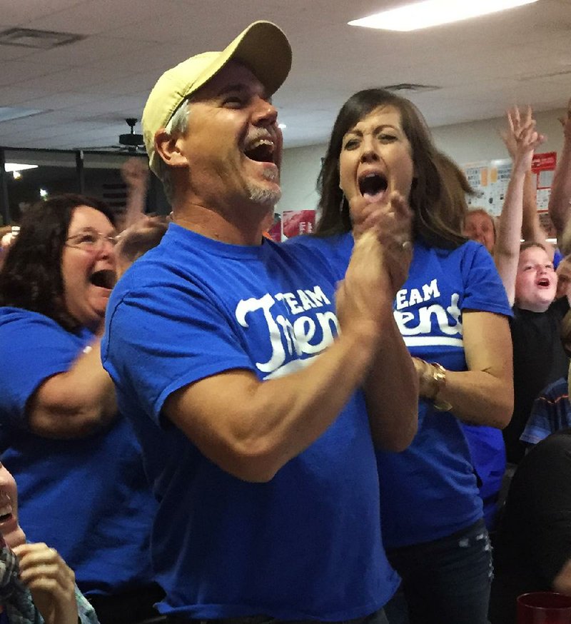 Bryan and Mandy Couch cheer at a watch party Thursday night in Malvern as Trent Harmon is named the American Idol winner. 