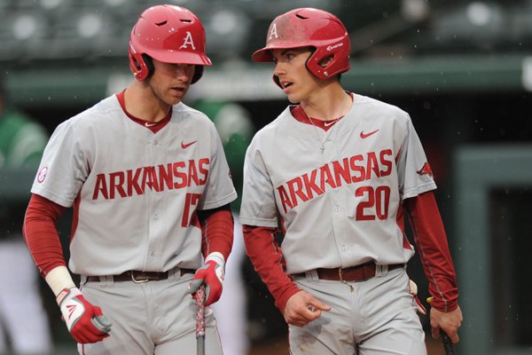 Arkansas' Carson Shaddy (20) talks to Luke Bonfield (17) during the Razorbacks' game against Mississippi Valley State on Tuesday, Feb. 23, 2016, at Baum Stadium in Fayetteville.