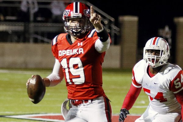 In this photo taken Nov. 13, 2015, Opelika quarterback Jake Bentley signals to a receiver during a high school football game against Hillcrest in Opelika, Ala. Bentley announced this week he will skip his senior year of high school altogether and enroll at the University of South Carolina this summer. (Todd J. Van Emst/Opelika-Auburn News via AP)