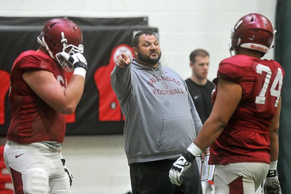 Arkansas offensive line coach Kurt Anderson talks to players during practice Tuesday, April 5, 2016, at the Walker Pavilion in Fayetteville. 